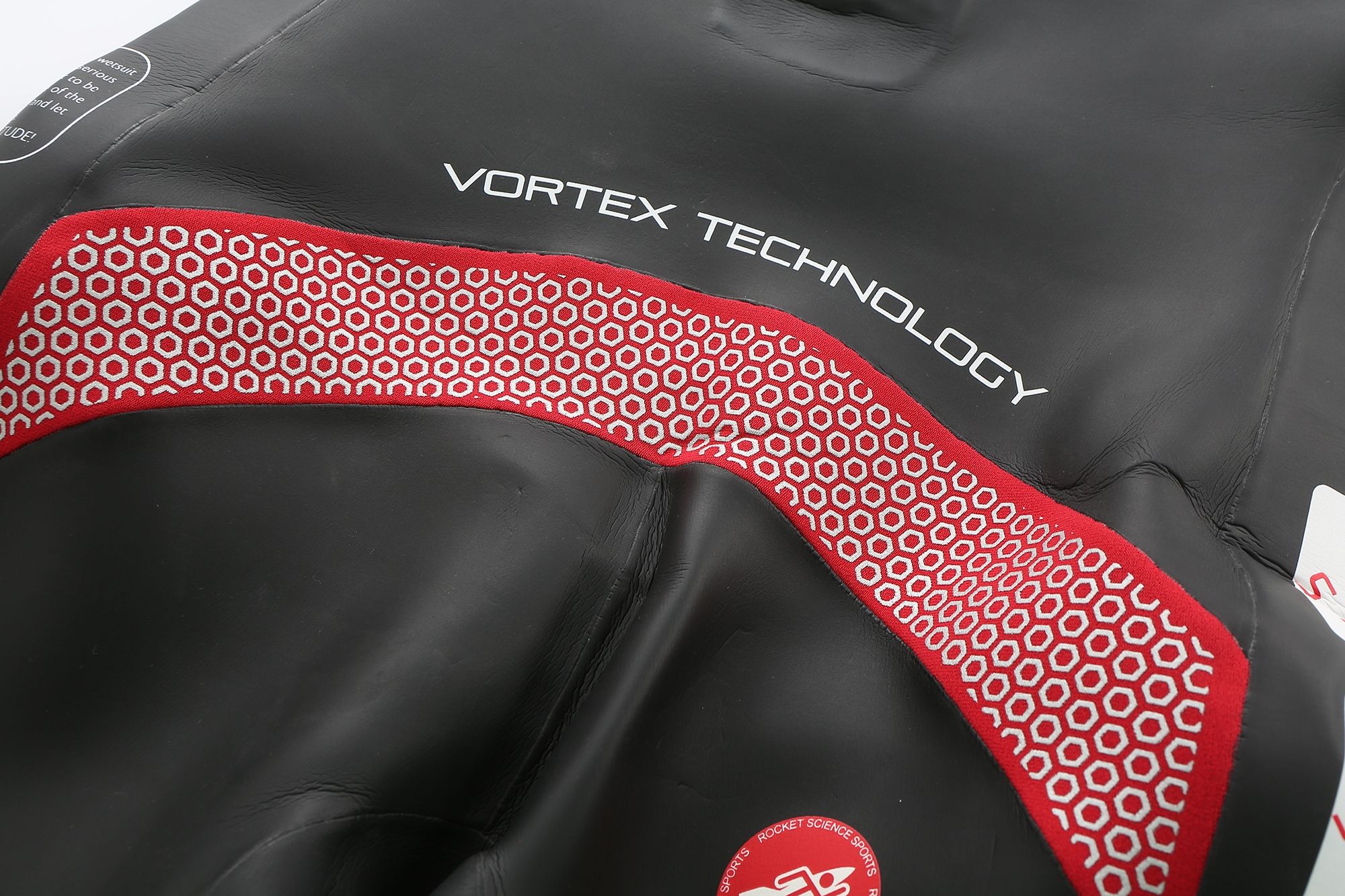 Close-up of Rocket Aquasense wetsuit Vortex Technology grip panel on lower back