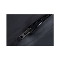 Close-up of BASIC wetsuit zipper and pull tab on black neoprene.