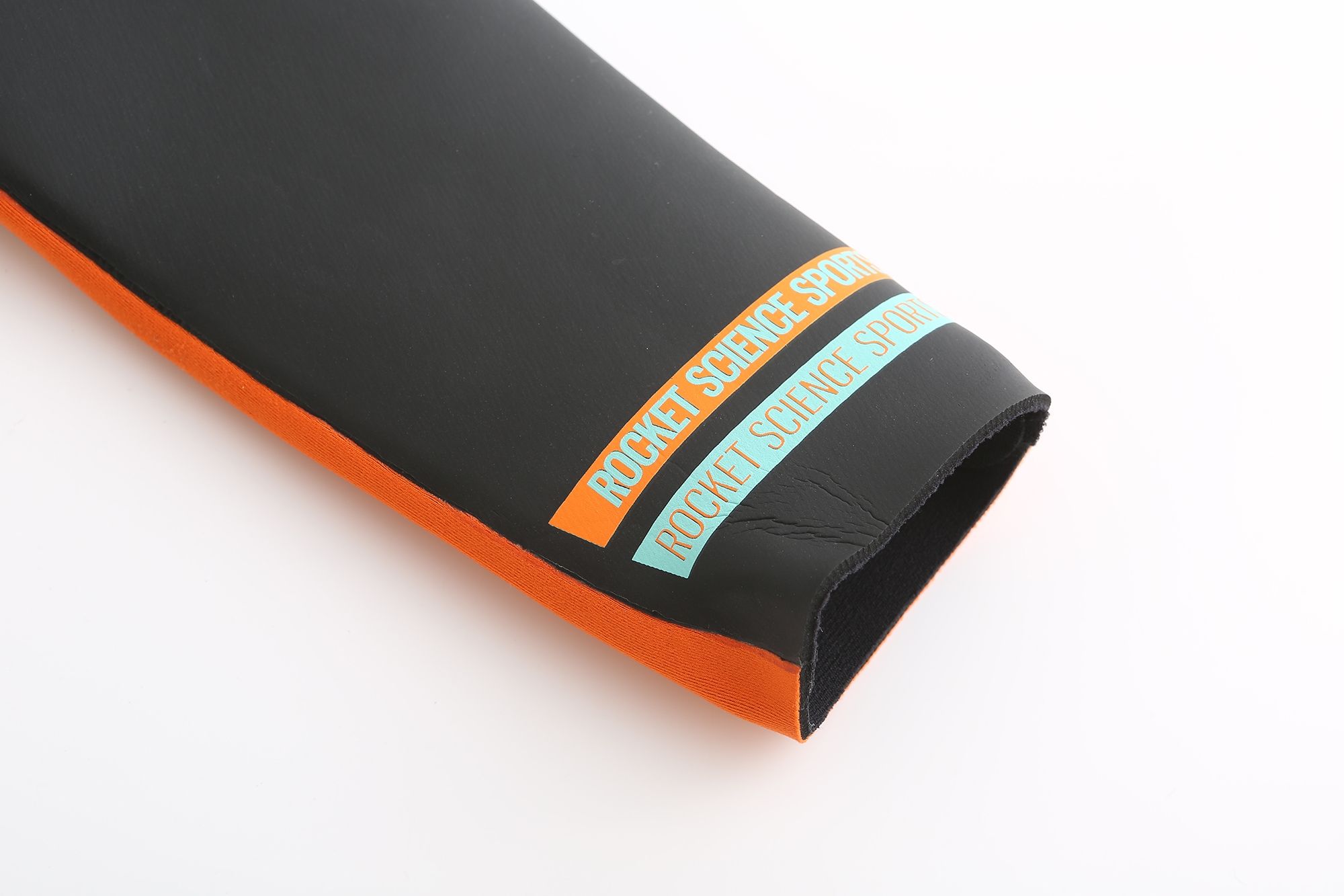 Close-up of Rocket Science Sports branding on wetsuit sleeve cuff with smooth-skin neoprene finish