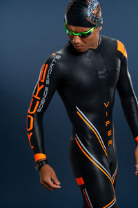 Male athlete wearing Rocket Science Sports men’s Viper long-sleeve wetsuit with orange detailing, shown in three-quarter front view