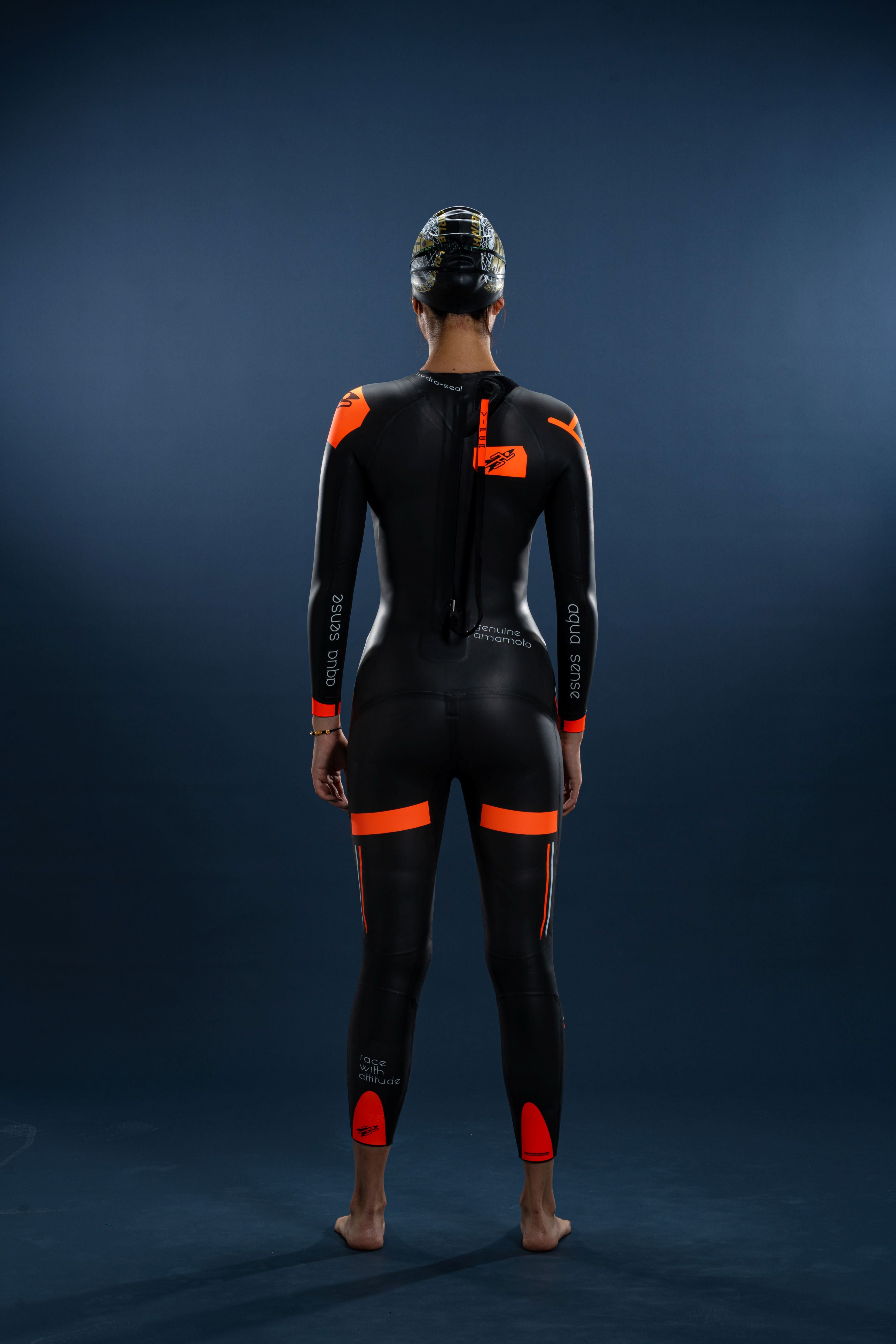 Back view of Rocket Science Sports Viper women’s long-sleeve wetsuit with rear zip and orange performance detailing