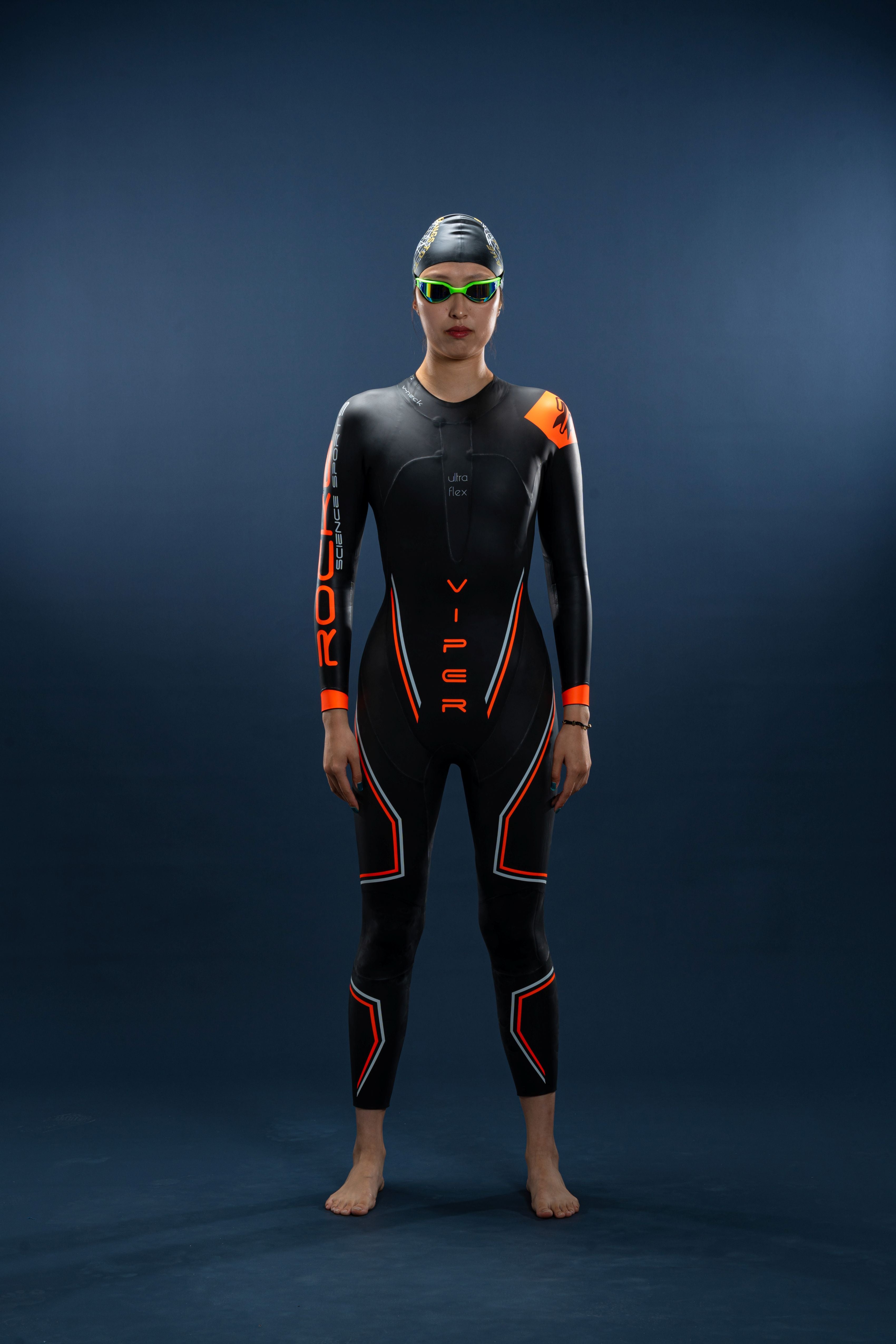 Front view of Rocket Science Sports Viper women’s long-sleeve wetsuit showing streamlined fit and orange accent panels