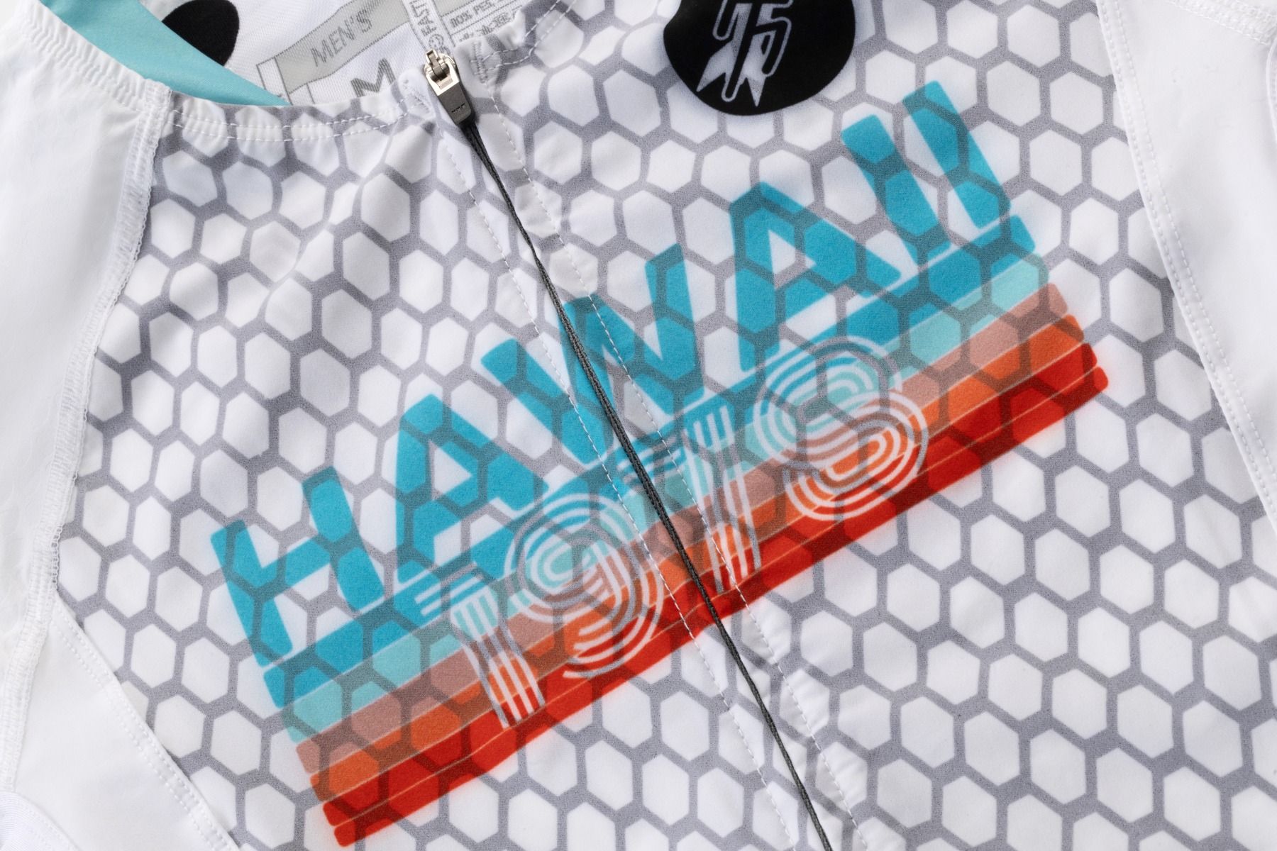 Close-up of a product with 'Hawaii' text and geometric patterns on a white background