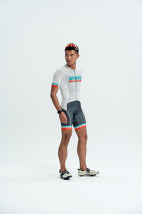 Person wearing a cycling outfit with a visible brand logo on a white background