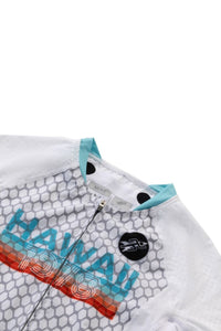 Close-up of a white shirt with blue and red 'Hawaii' text on a white background