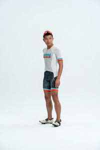Person wearing a cycling outfit with a white background