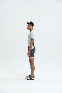 Person wearing a cycling outfit on a white background