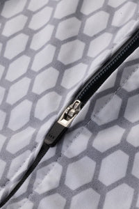 Close-up of a zipper on a fabric with a geometric pattern